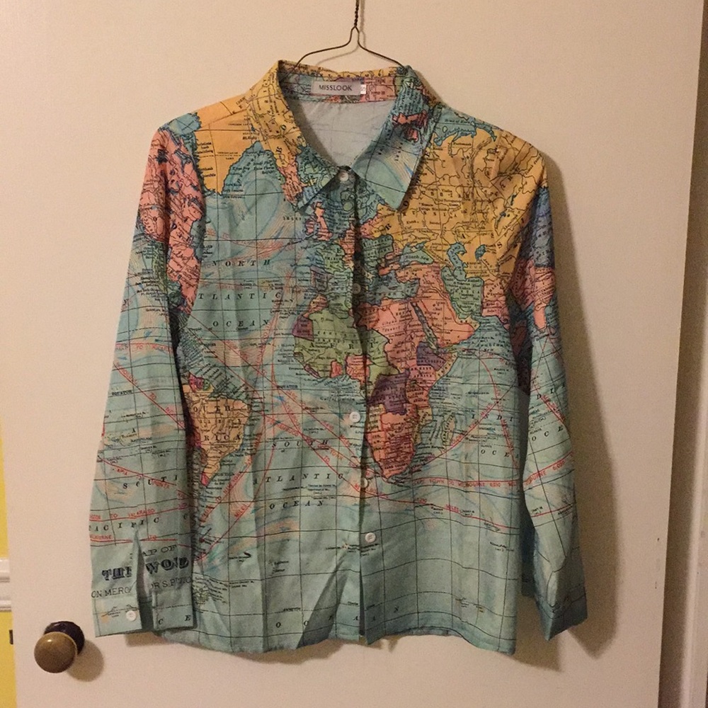 Blouse button down world pattern. Never worn